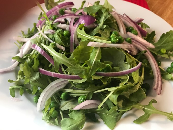 arugula with sliced red onions